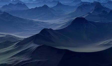 A blue-tinted environment made of craters and sharp mountain ridges and mist.